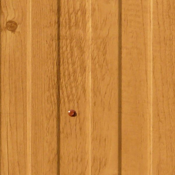 New wood paneling with embedded vertical pattern and installed with screws.